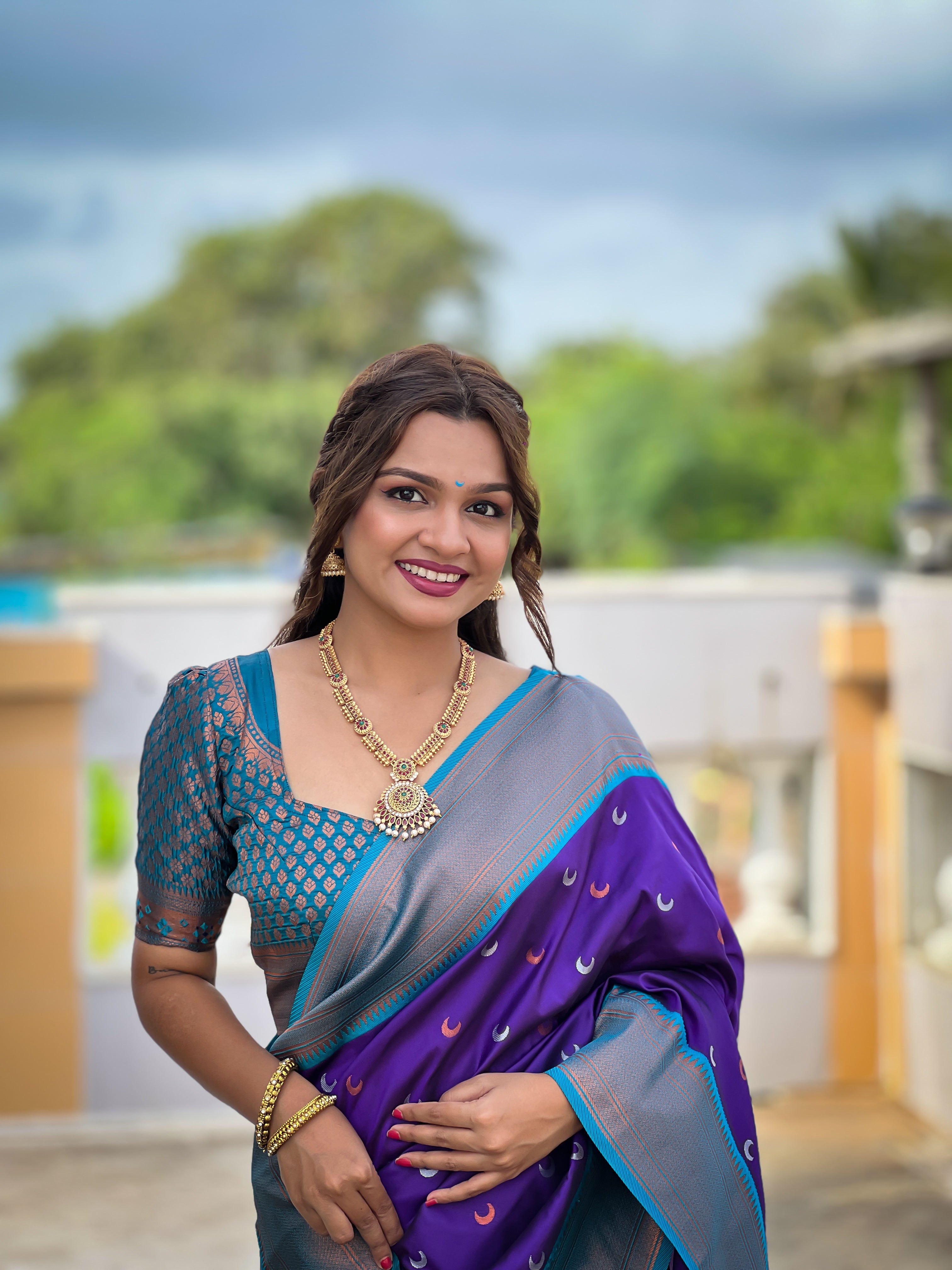 Soft Paithani Silk Saree; Pure Paithani Zari Weaving; Traditional Meenakari Moon Design Saree; Rich Meenakari Woven Pallu and Border; Tassels on Pallu; Contrast Woven Silk Blouse with Sleeve Border