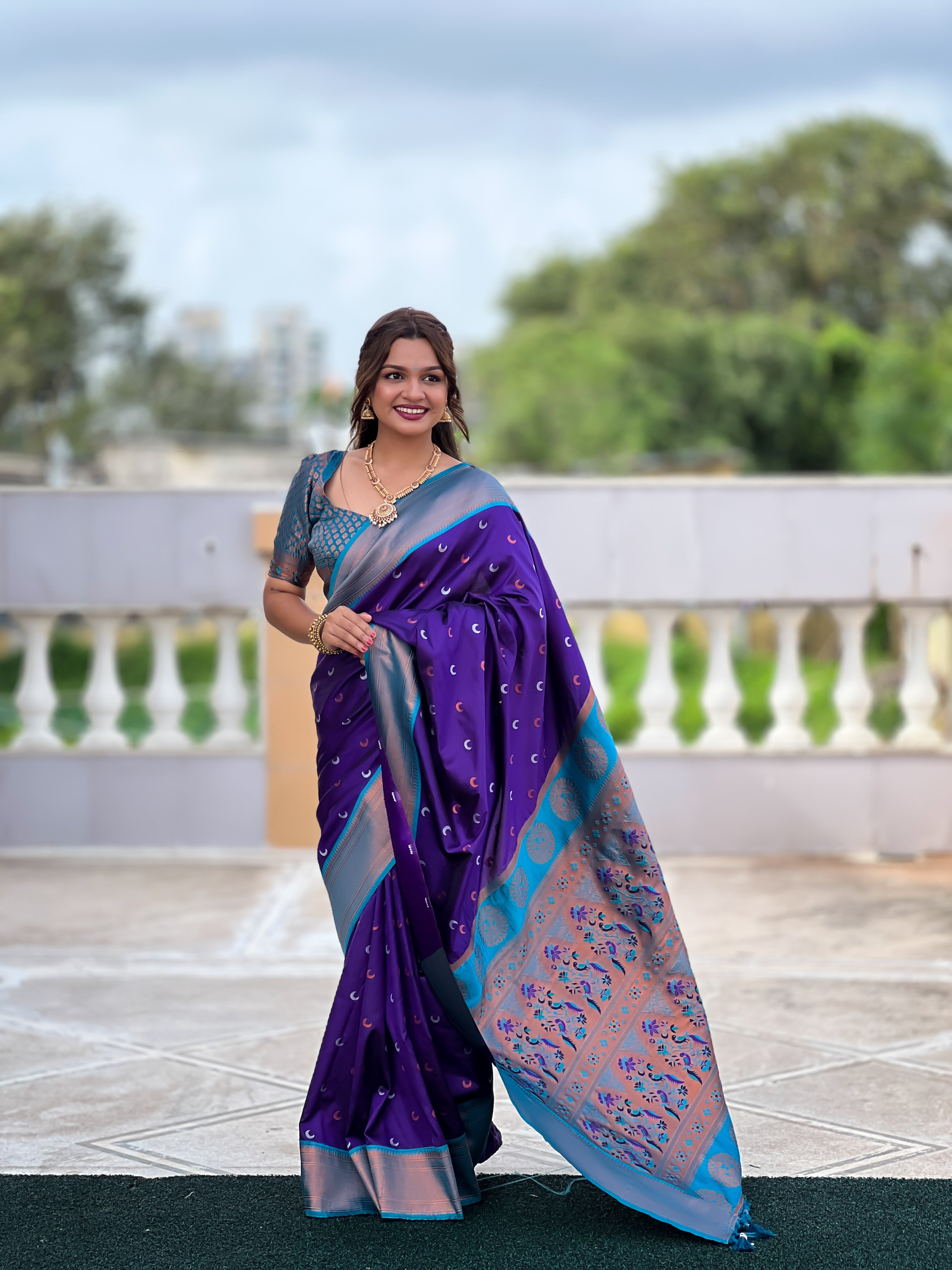 Soft Paithani Silk Saree; Pure Paithani Zari Weaving; Traditional Meenakari Moon Design Saree; Rich Meenakari Woven Pallu and Border; Tassels on Pallu; Contrast Woven Silk Blouse with Sleeve Border