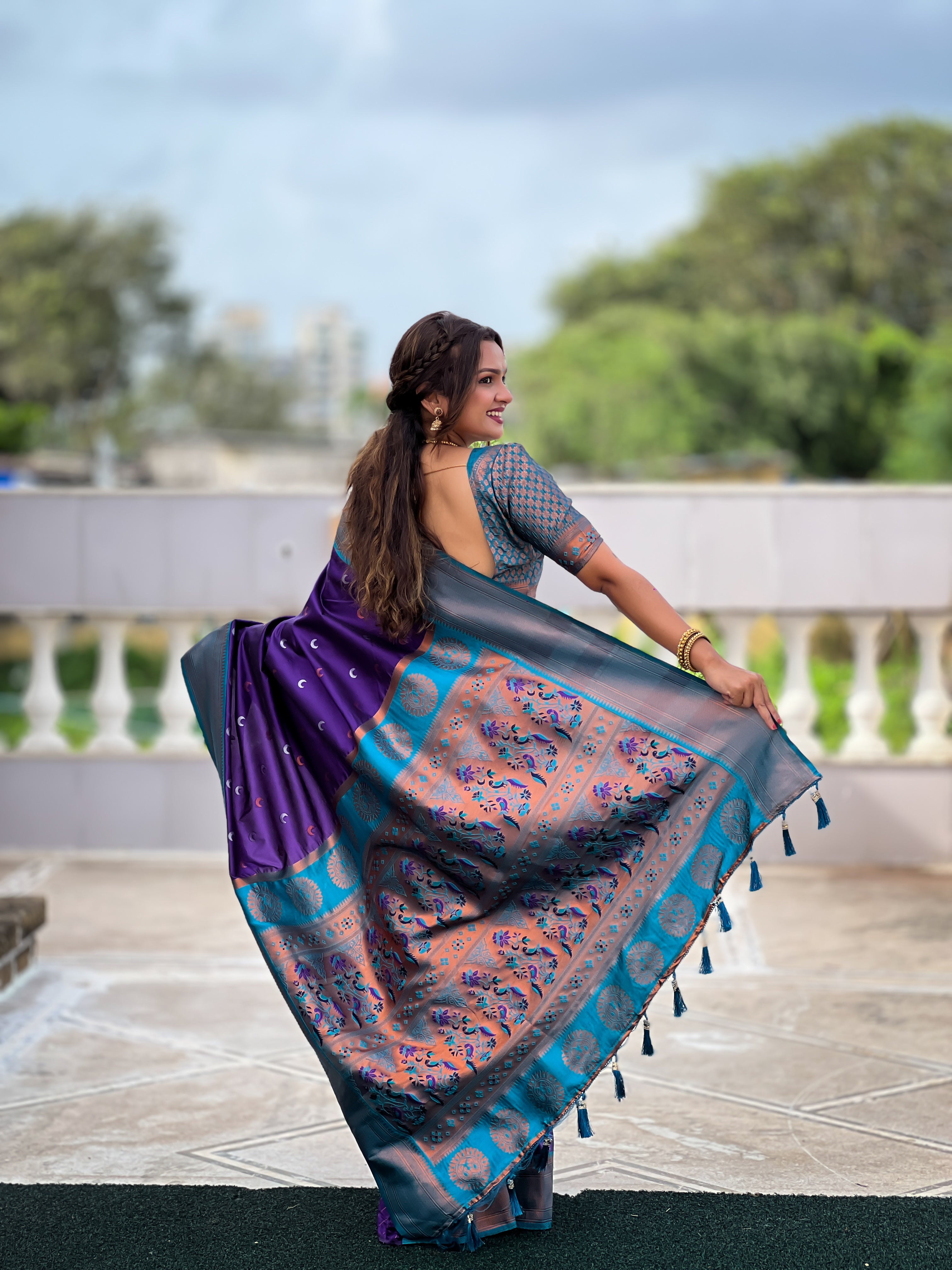 Soft Paithani Silk Saree; Pure Paithani Zari Weaving; Traditional Meenakari Moon Design Saree; Rich Meenakari Woven Pallu and Border; Tassels on Pallu; Contrast Woven Silk Blouse with Sleeve Border