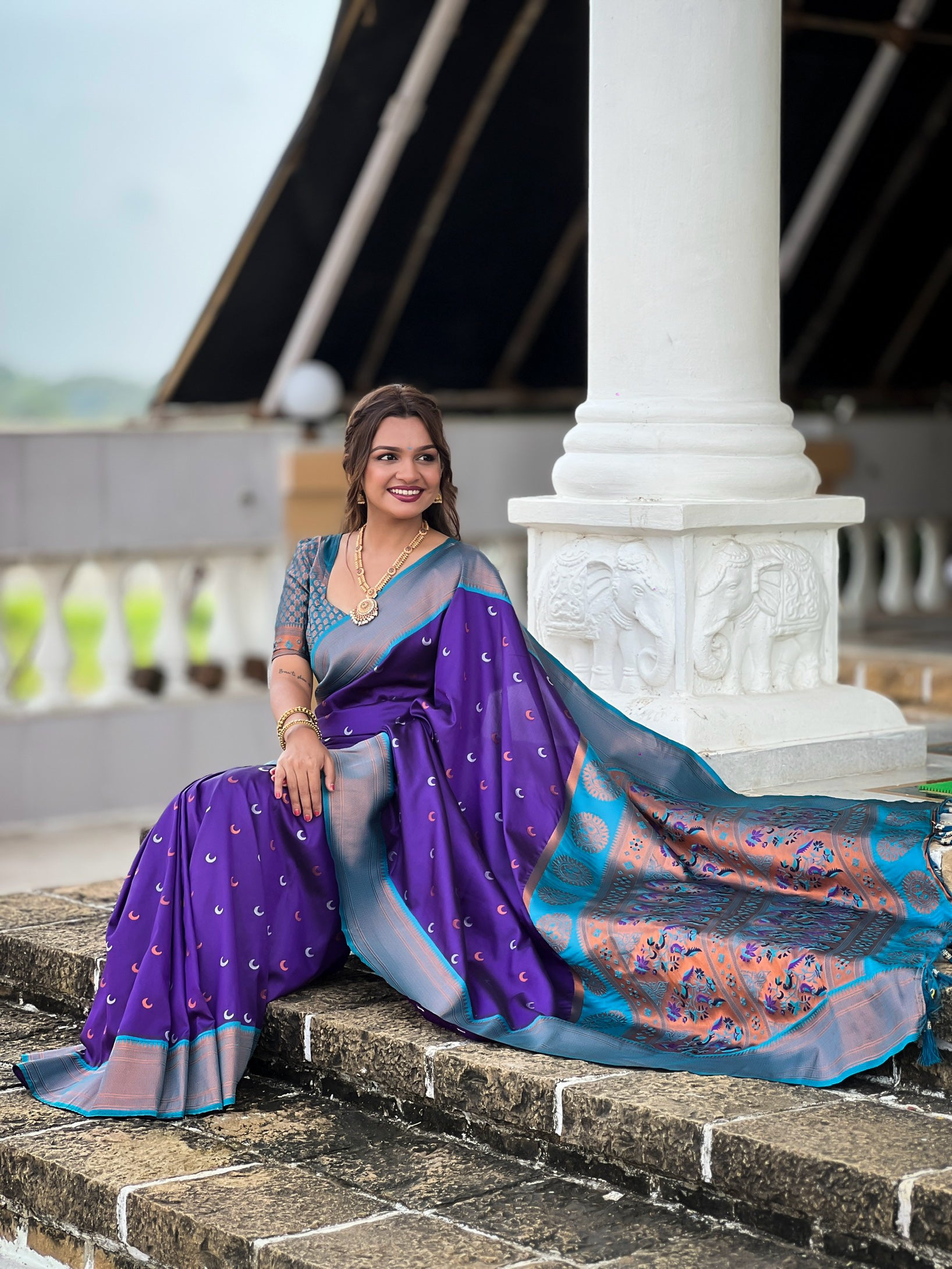 Soft Paithani Silk Saree; Pure Paithani Zari Weaving; Traditional Meenakari Moon Design Saree; Rich Meenakari Woven Pallu and Border; Tassels on Pallu; Contrast Woven Silk Blouse with Sleeve Border