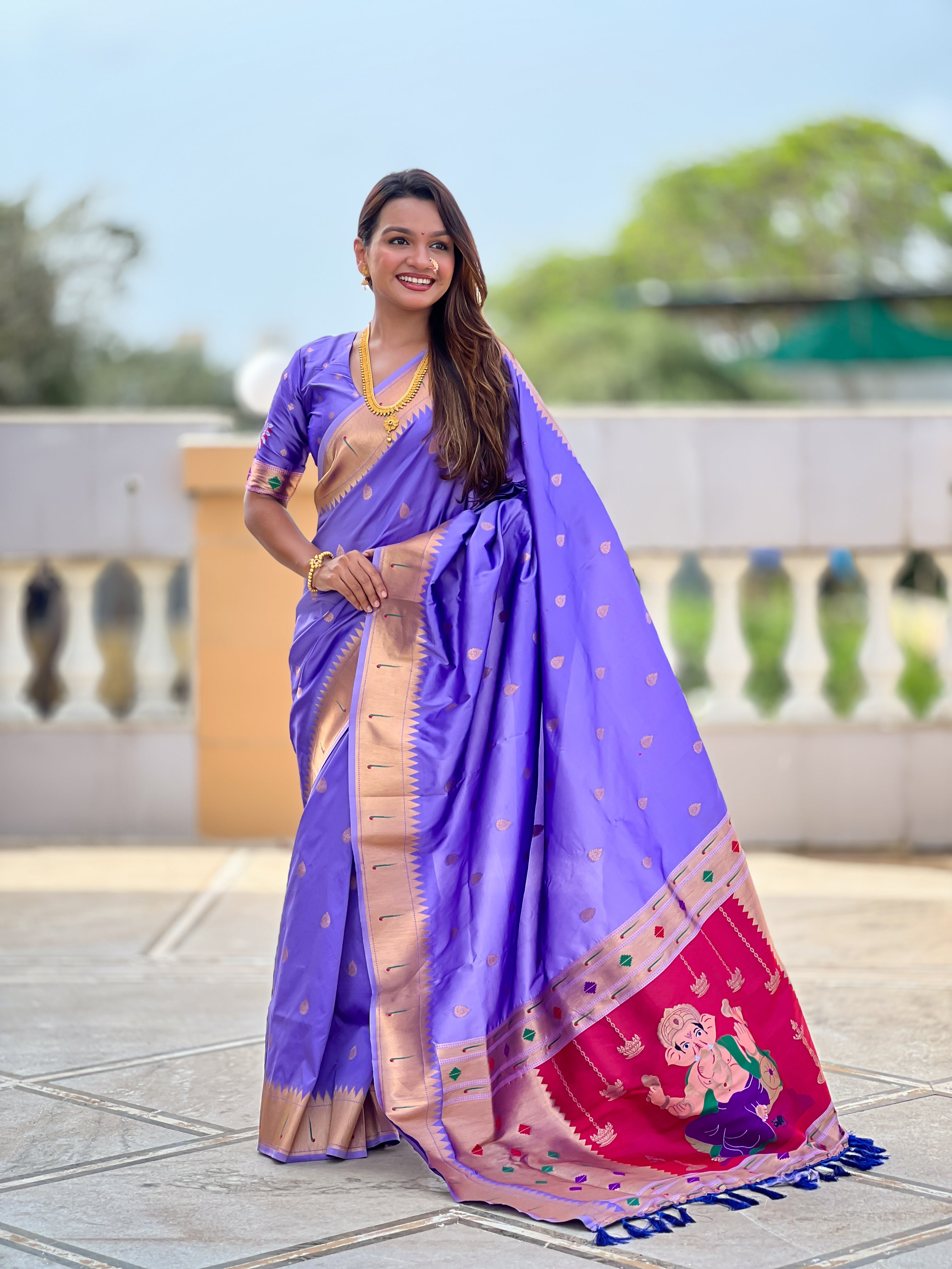 Soft Paithani Silk Saree; Pure Paithani Zari Weaving Motifs; Rich Meenakari Woven Pallu; Traditional Munia Border; Tassels on Pallu; Contrast Woven Silk Blouse with Sleeve Border