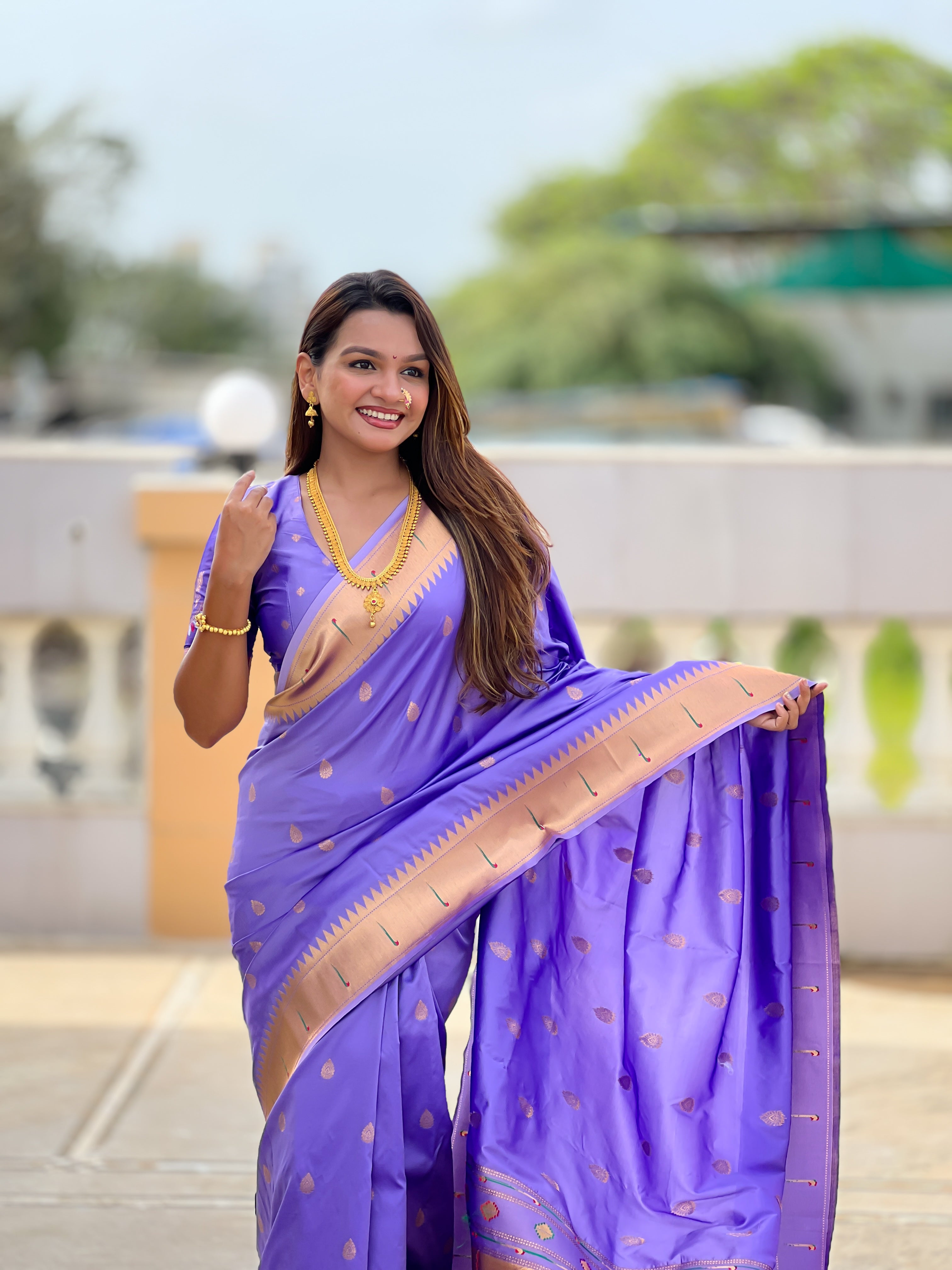Soft Paithani Silk Saree; Pure Paithani Zari Weaving Motifs; Rich Meenakari Woven Pallu; Traditional Munia Border; Tassels on Pallu; Contrast Woven Silk Blouse with Sleeve Border