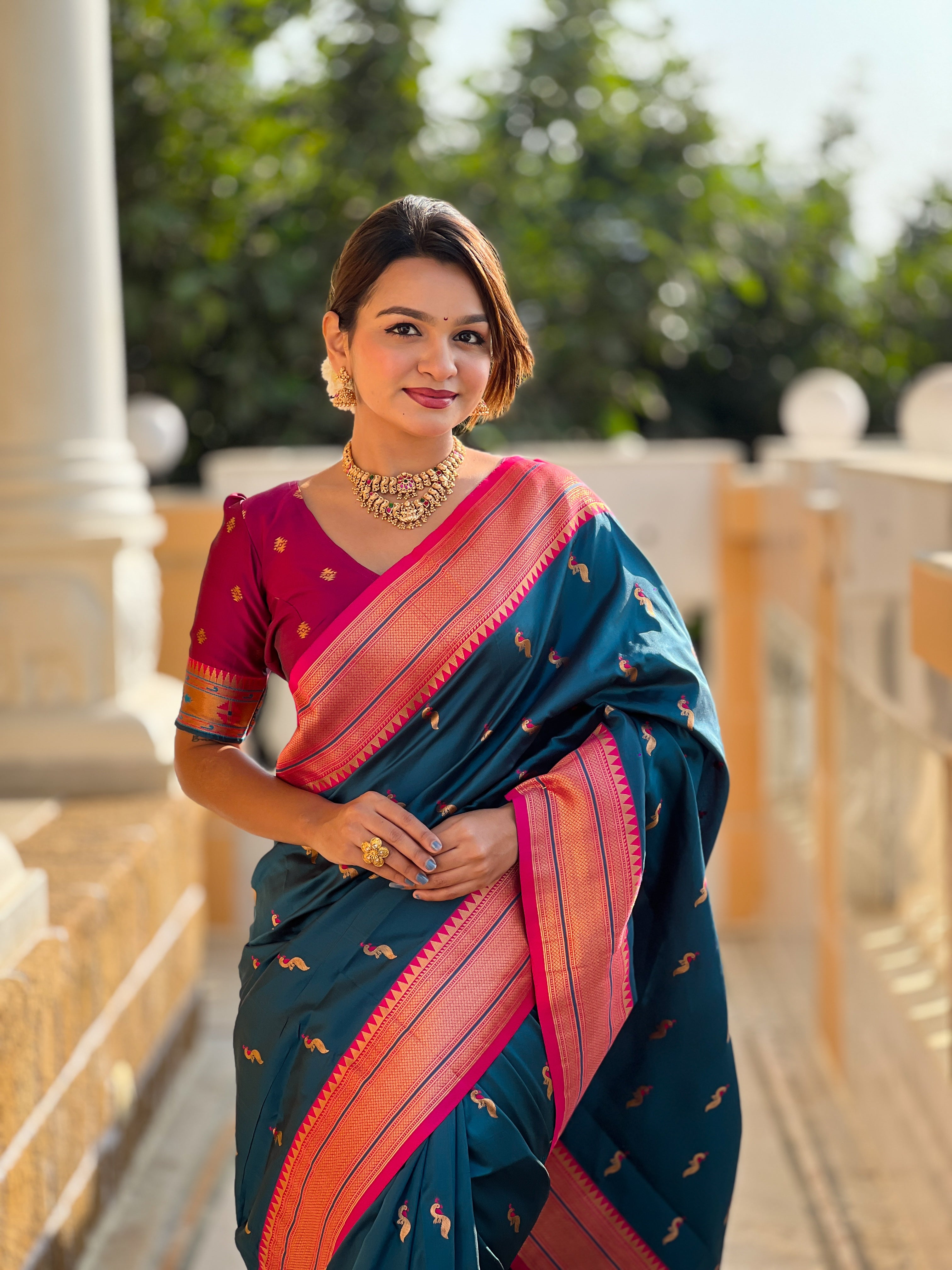 Woman wearing soft Paithani silk saree with meenakari zari border and rich pallu