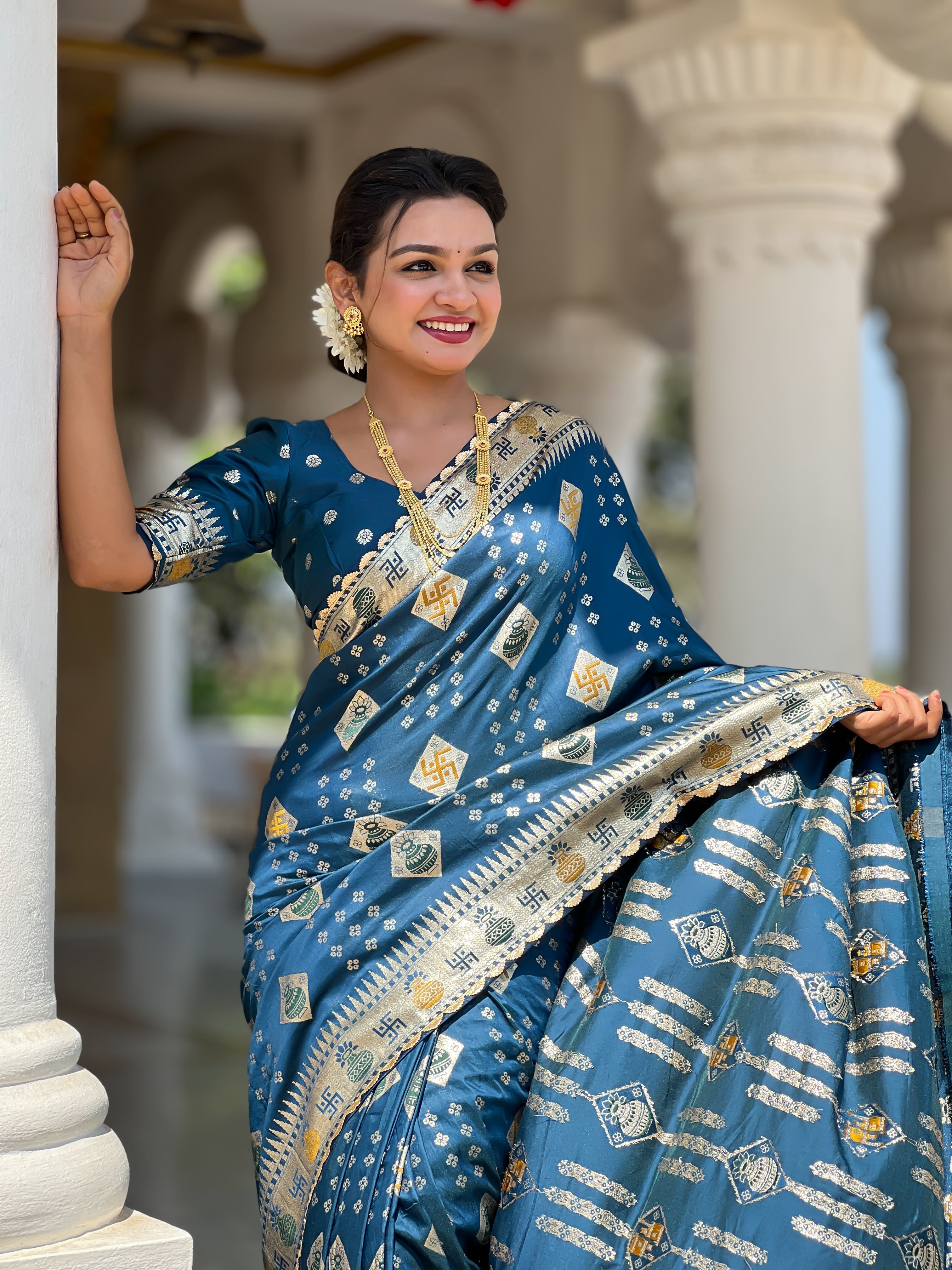 Woman wearing a Morpich soft dola silk saree with gold zari and meenakari weaving, featuring a heavy pallu and tassels, ideal for indian weddings