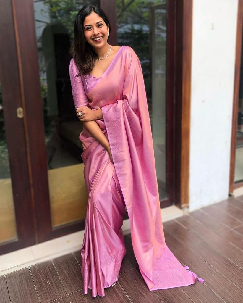 Banarasi Silk saree collection featuring heavy traditional zari weaving and high luster; available in four classic auspicious colors, including red, green, blue, and gold.