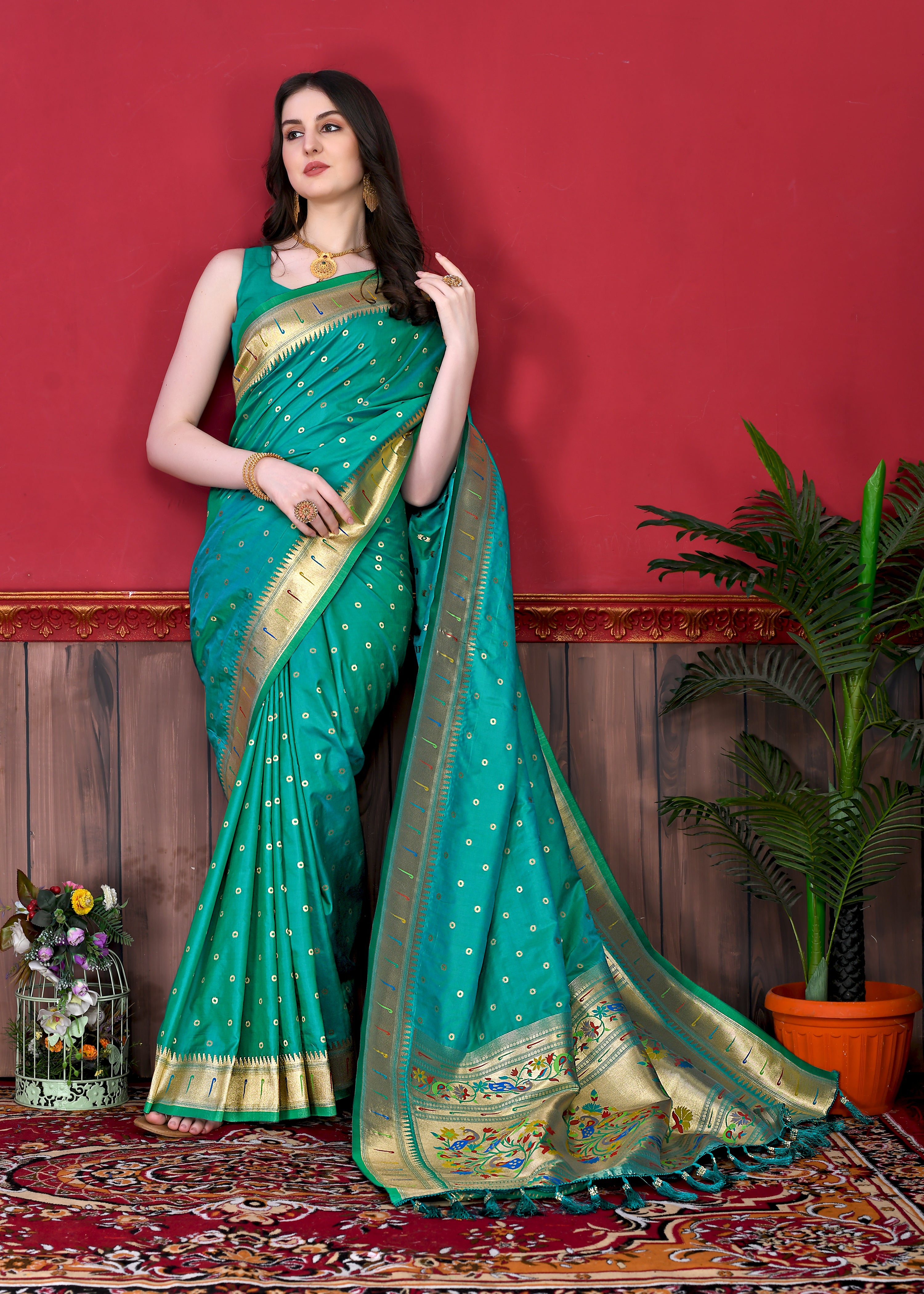 Model wearing Rama Soft Paithani Silk Saree with gold zari Meenakari border and rich pallu for wedding