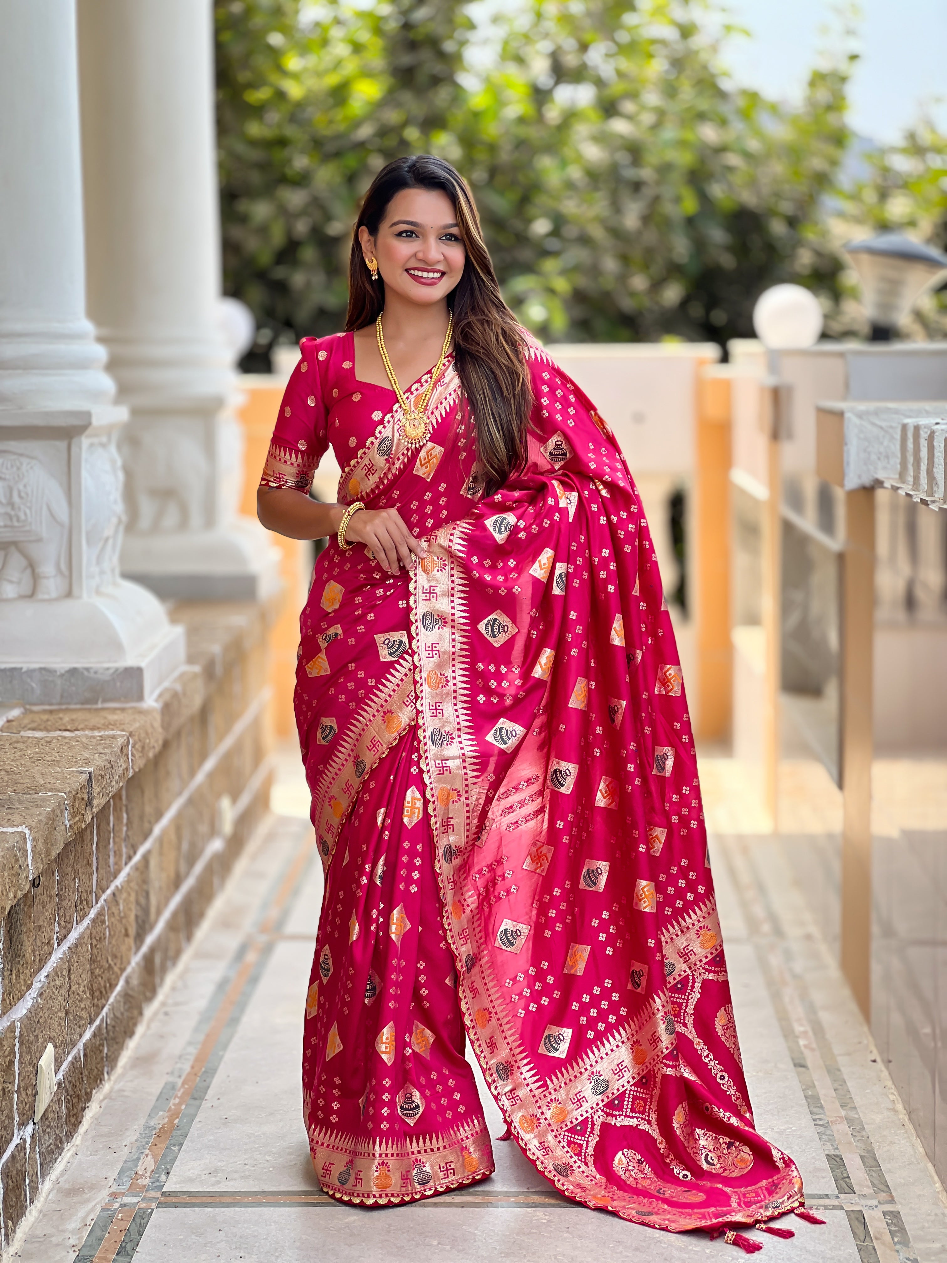 Woman wearing a Rani soft dola silk saree with gold zari and meenakari weaving, featuring a heavy pallu and tassels, ideal for indian weddings