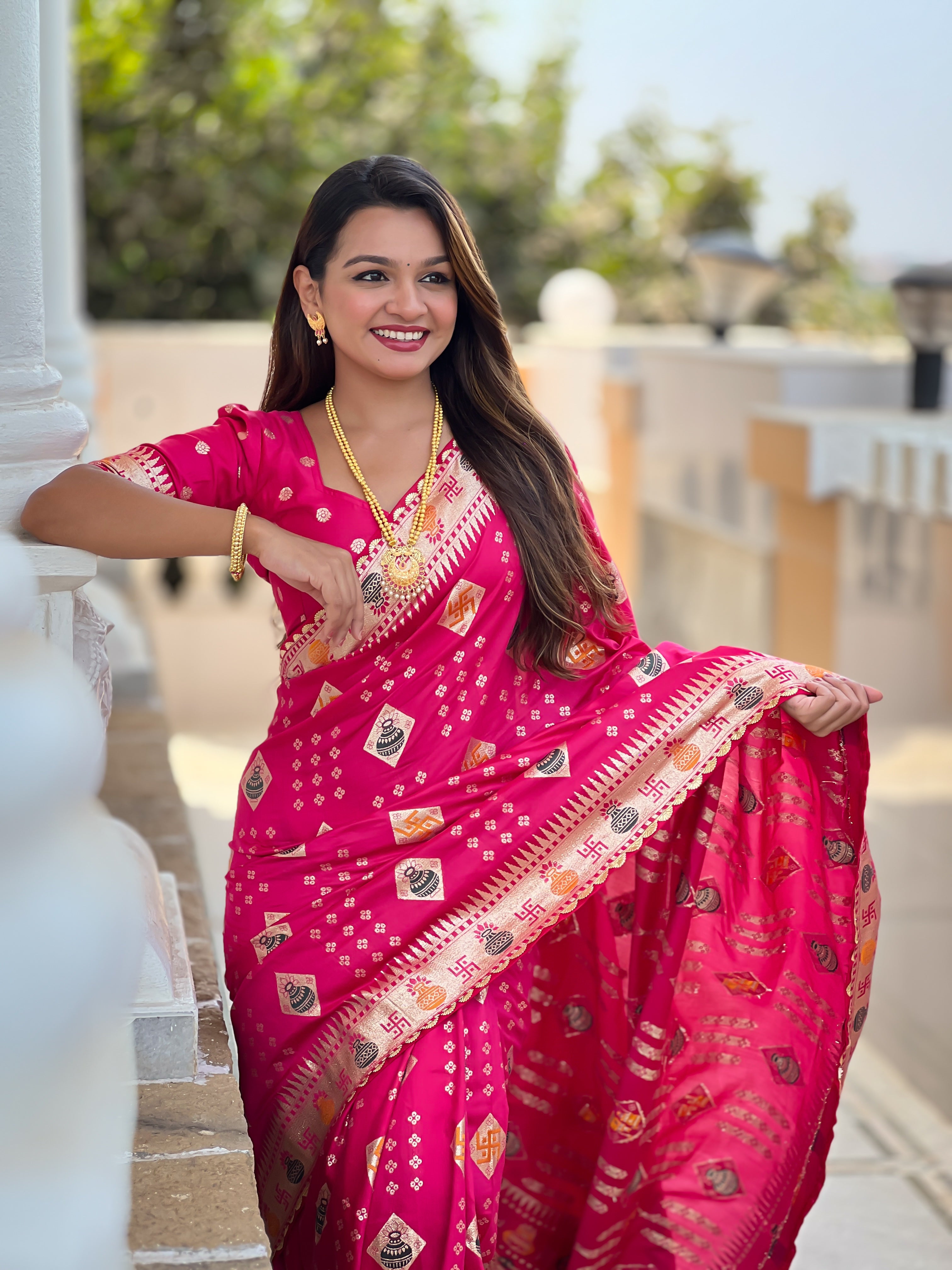 Woman wearing a Rani soft dola silk saree with gold zari and meenakari weaving, featuring a heavy pallu and tassels, ideal for indian weddings