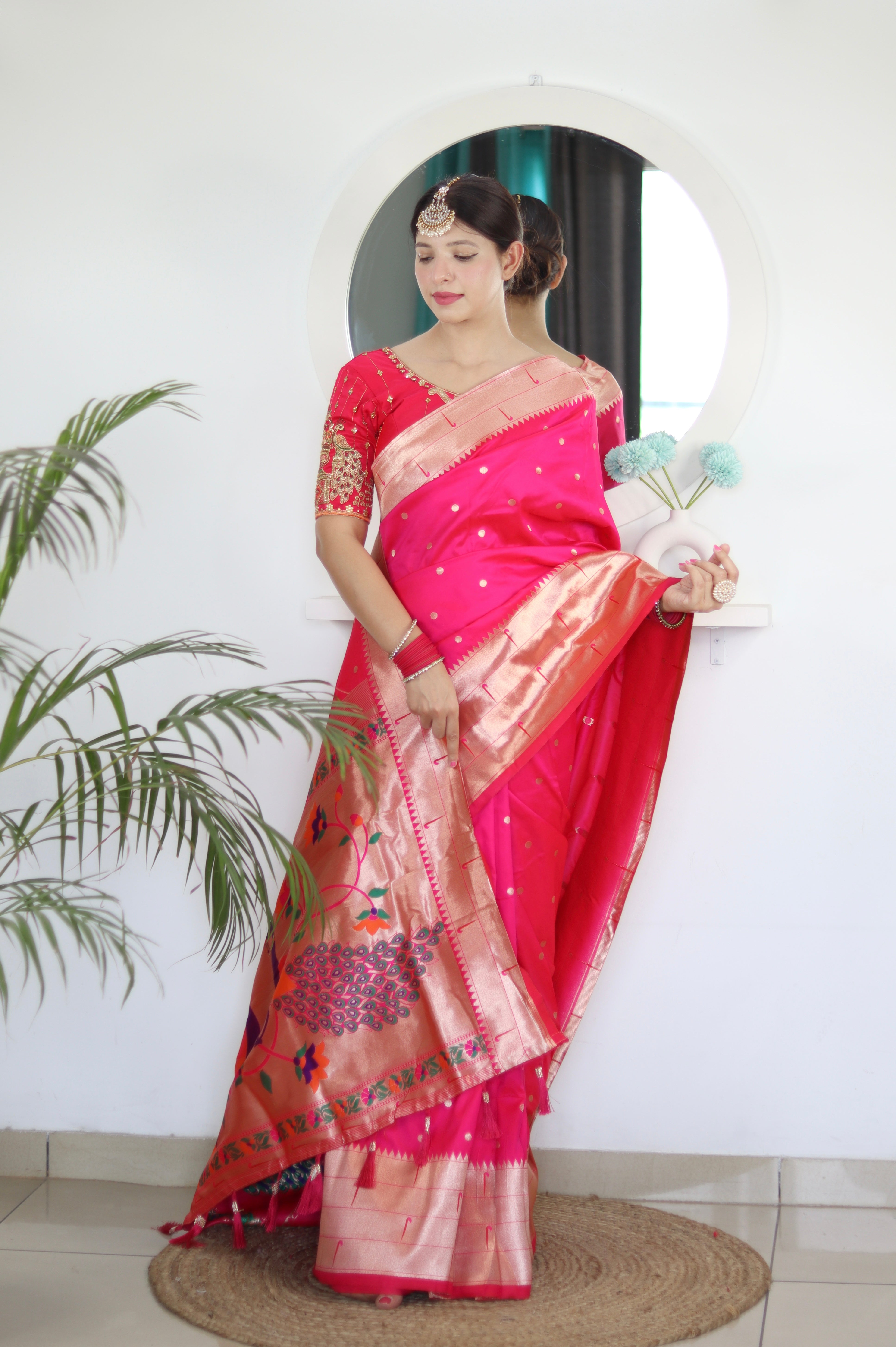Model wearing Rani Soft Kanjivaram Paithani Silk Saree with Meenakari Zari weaving and rich swan border