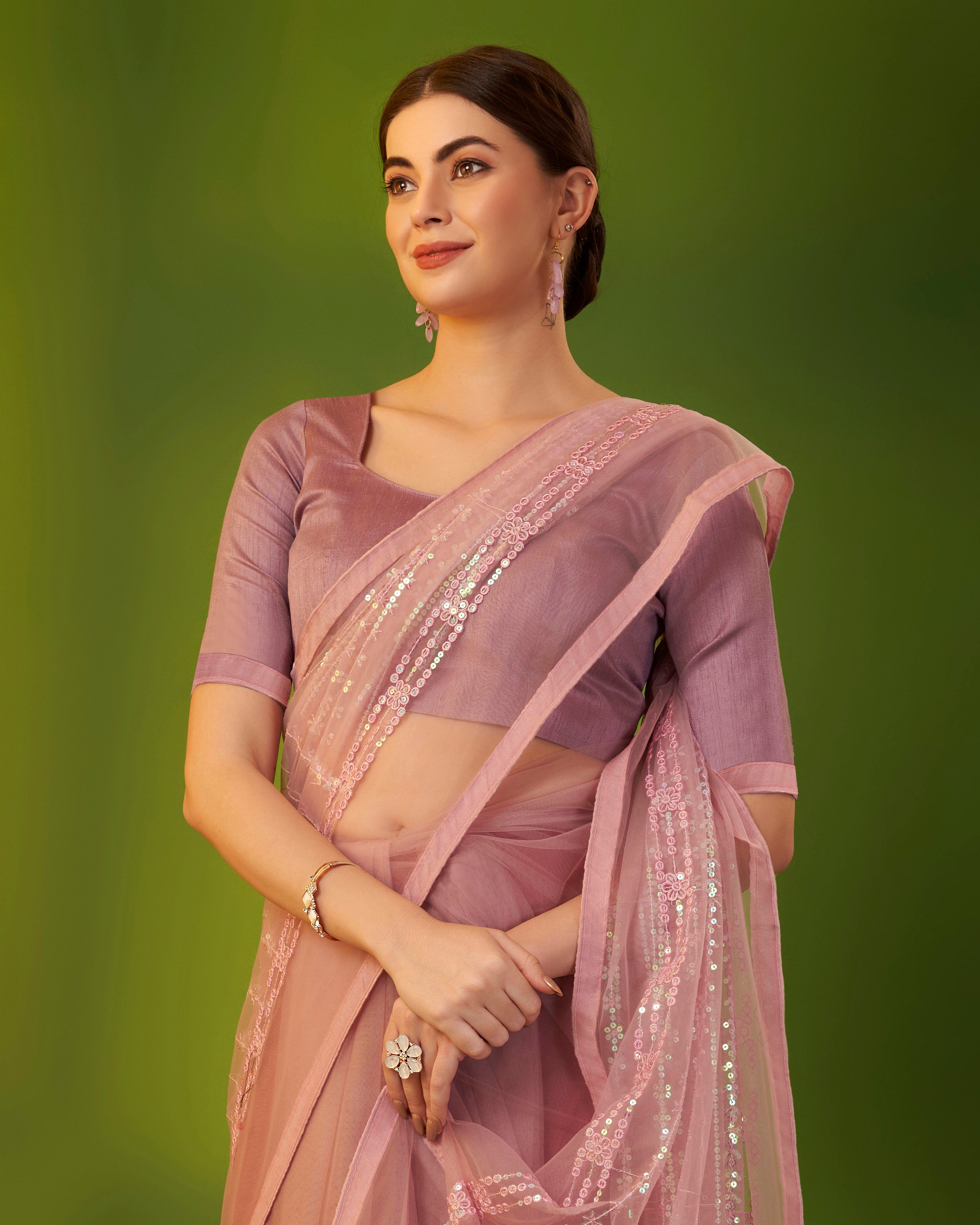 Mauve heavy butterfly net saree with 5mm sequence embroidery and tassel border worn by model