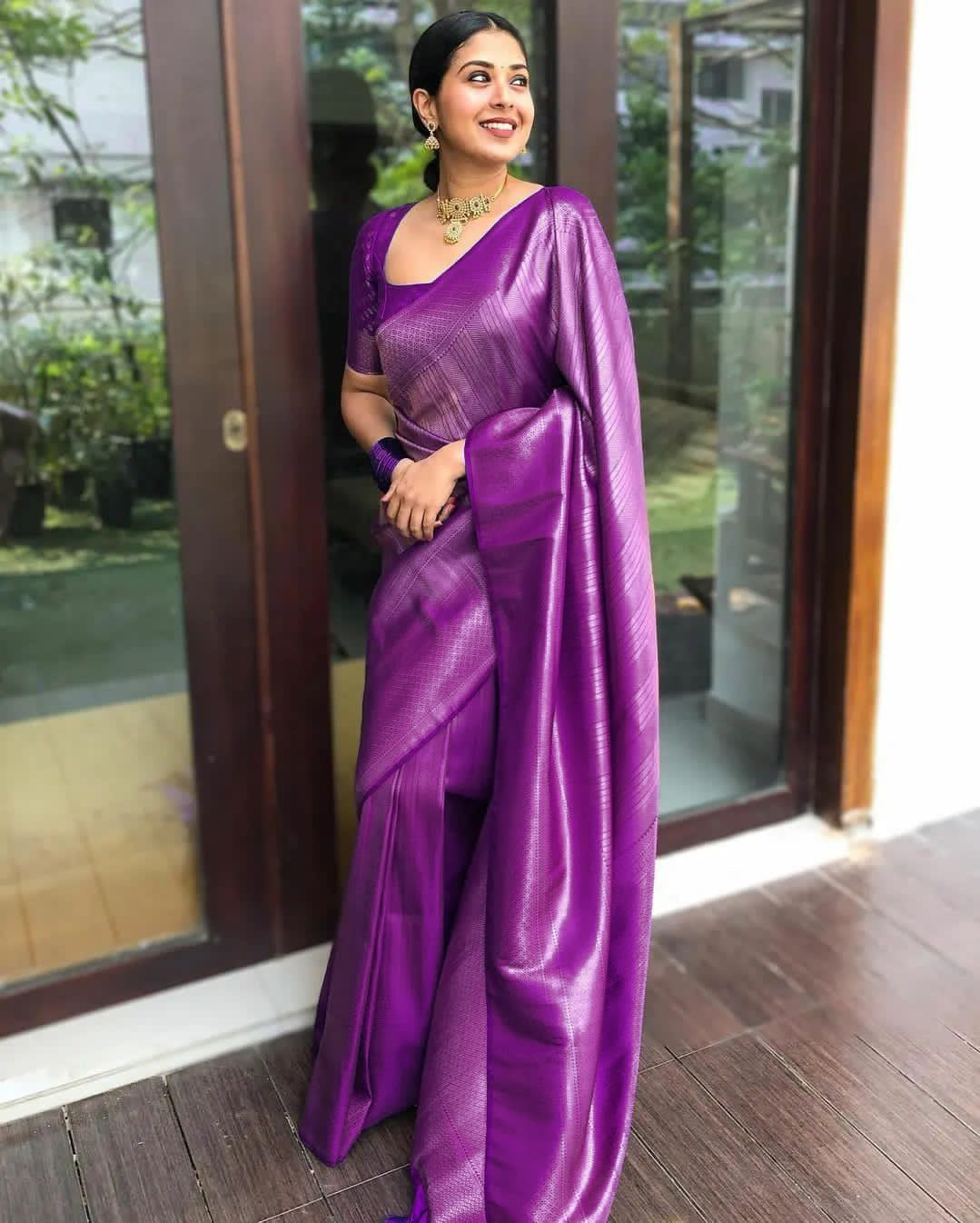 Banarasi Silk saree collection featuring heavy traditional zari weaving and high luster; available in four classic auspicious colors, including red, green, blue, and gold.