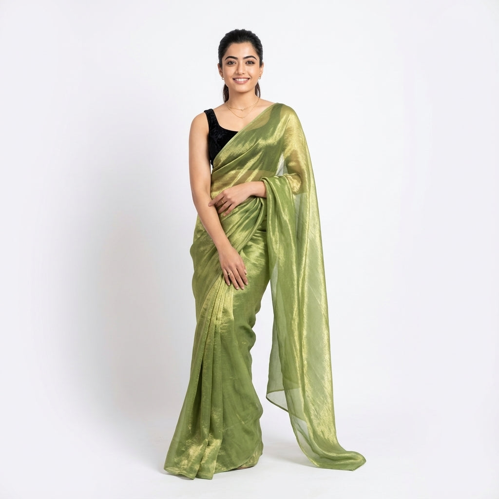 Elegant olive green fandy saree styled with velvet contrast blouse