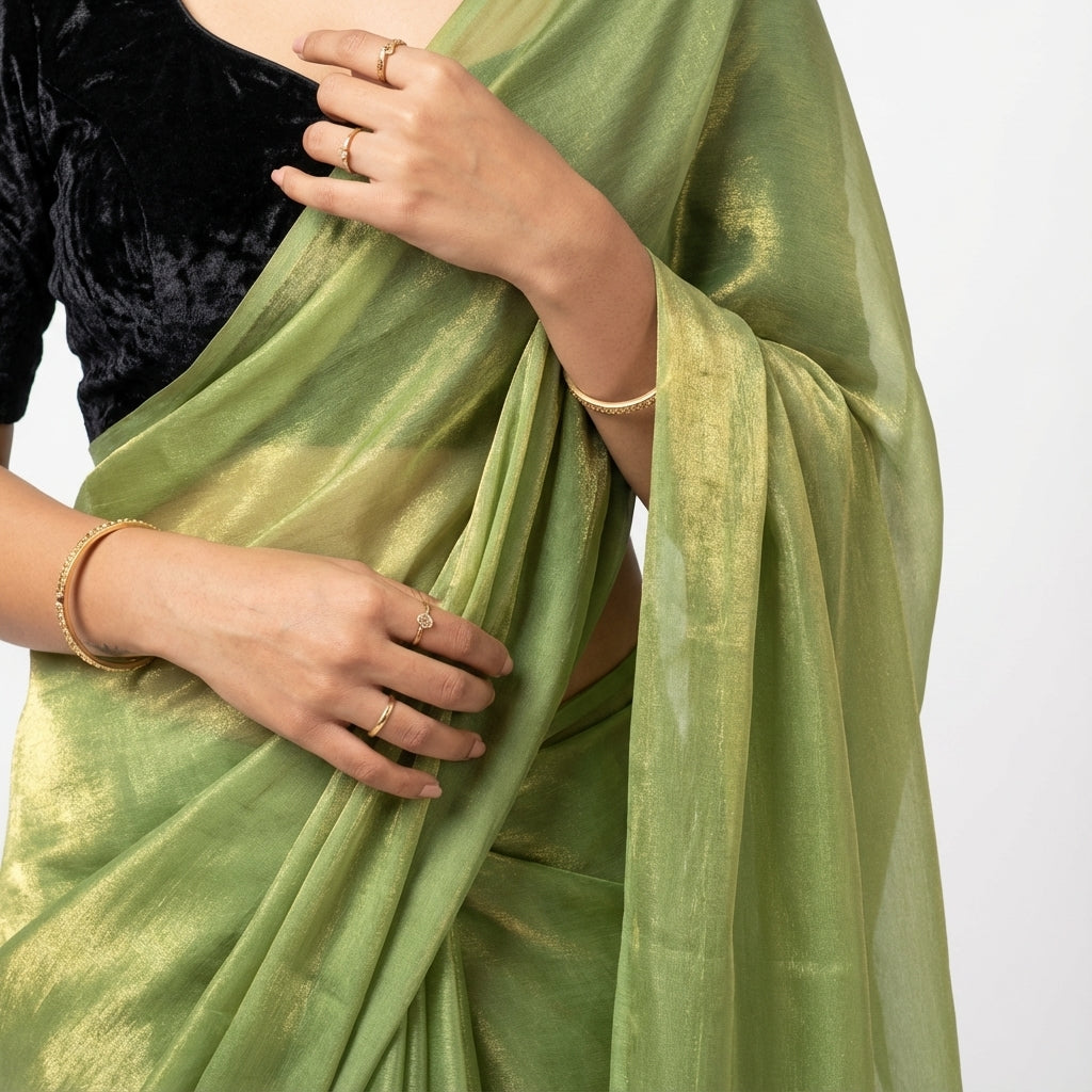 Elegant olive green fandy saree styled with velvet contrast blouse