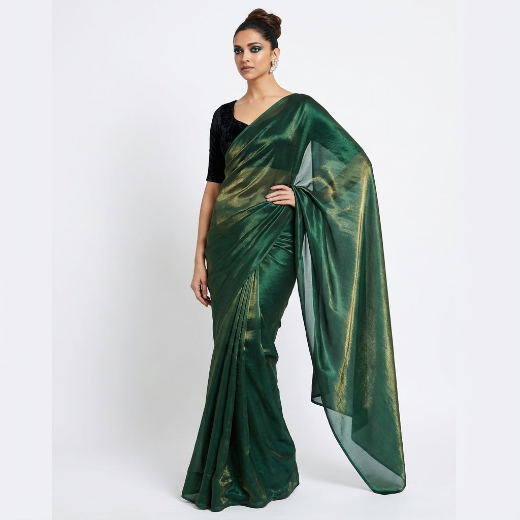 Bottle green fandy saree paired with velvet blouse for royal ethnic look