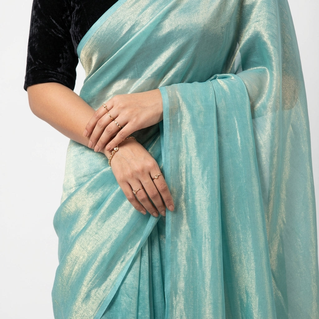 Elegant teal blue fandy saree paired with velvet blouse fabric