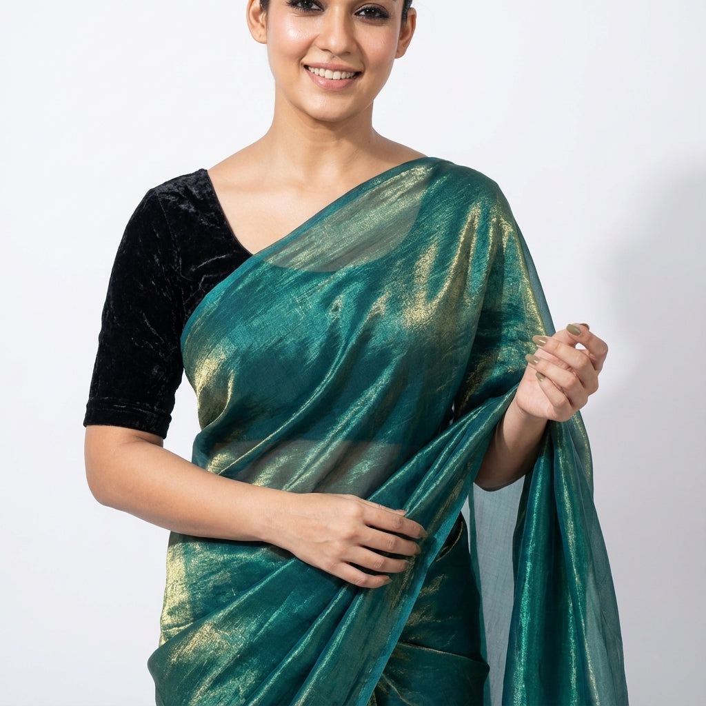Elegant teal blue fandy saree highlighted with velvet contrast blouse