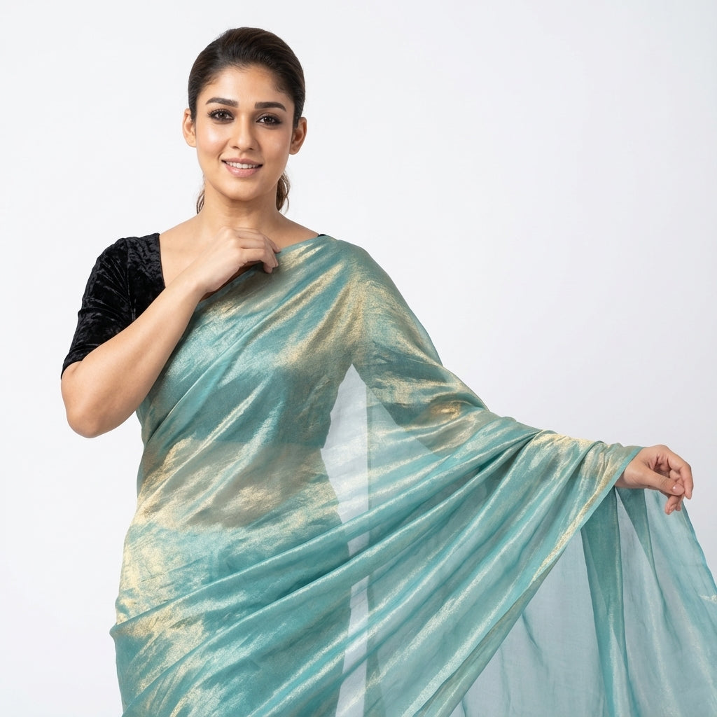 Elegant teal blue fandy saree paired with velvet blouse fabric