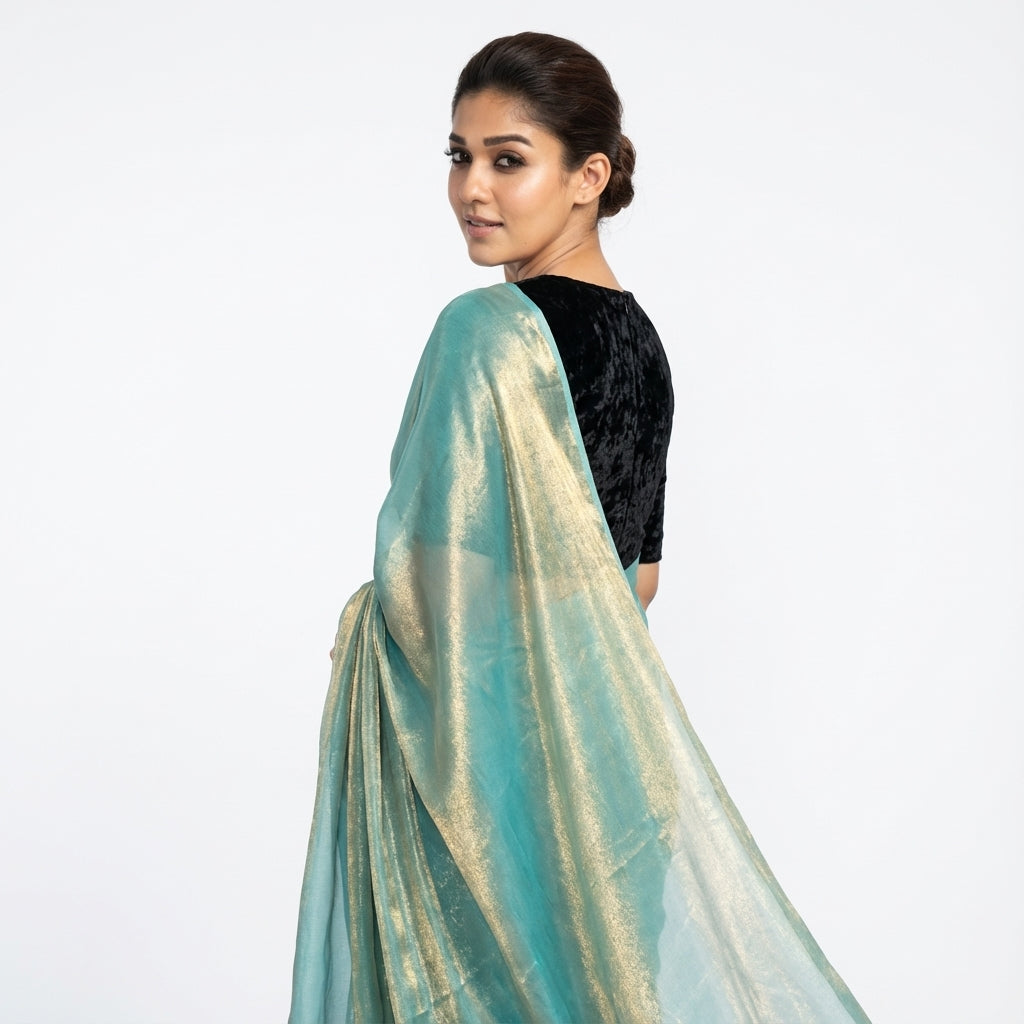 Elegant teal blue fandy saree paired with velvet blouse fabric