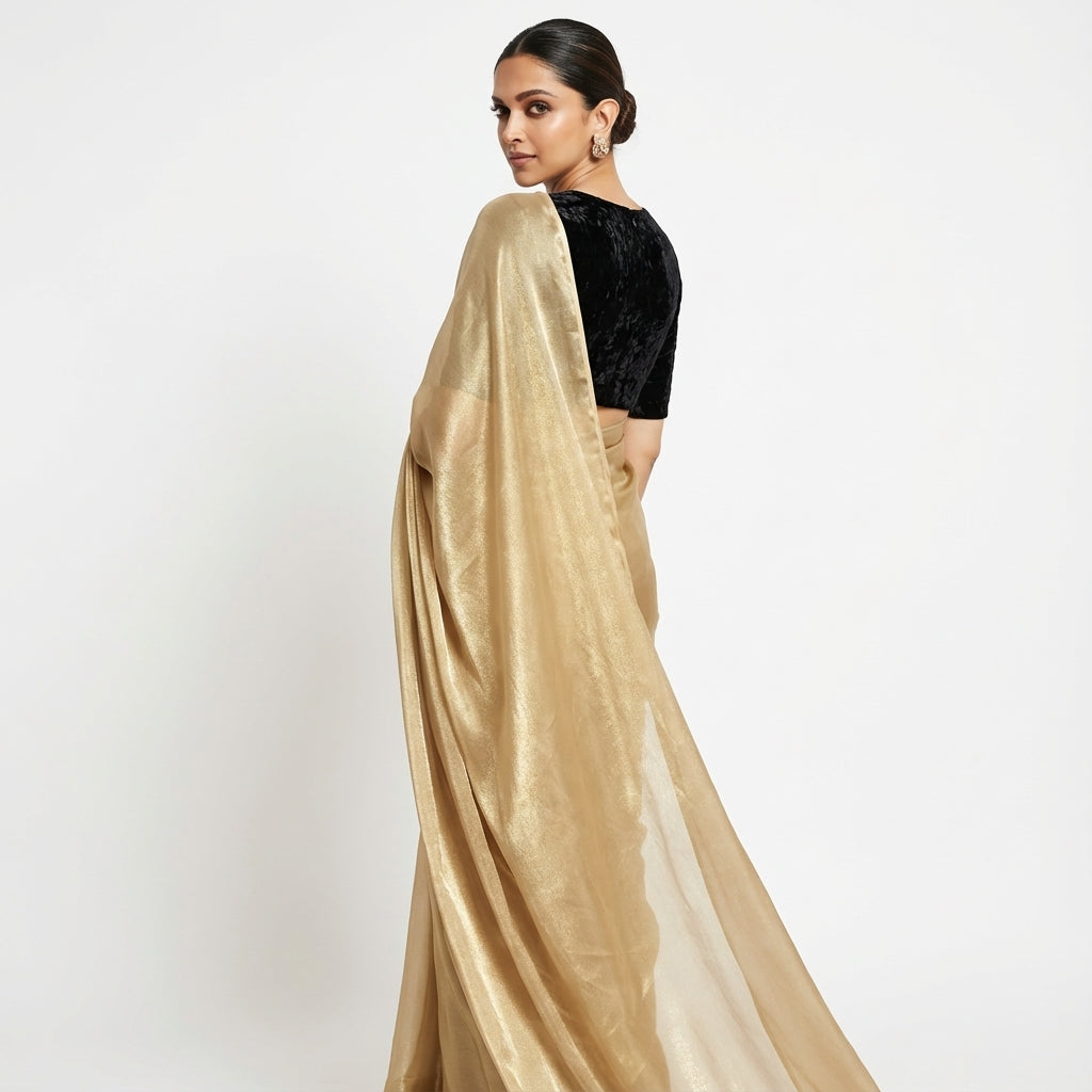 Classic cream fandy saree styled with velvet blouse contrast