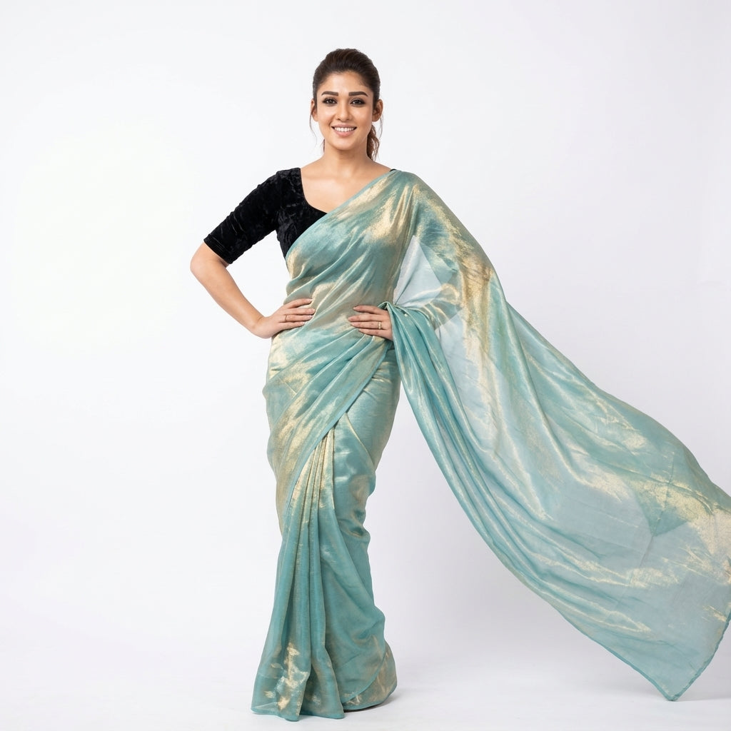 Elegant teal blue fandy saree paired with velvet blouse fabric