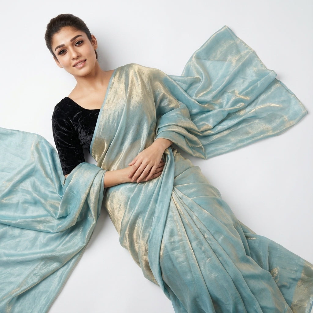 Elegant teal blue fandy saree paired with velvet blouse fabric