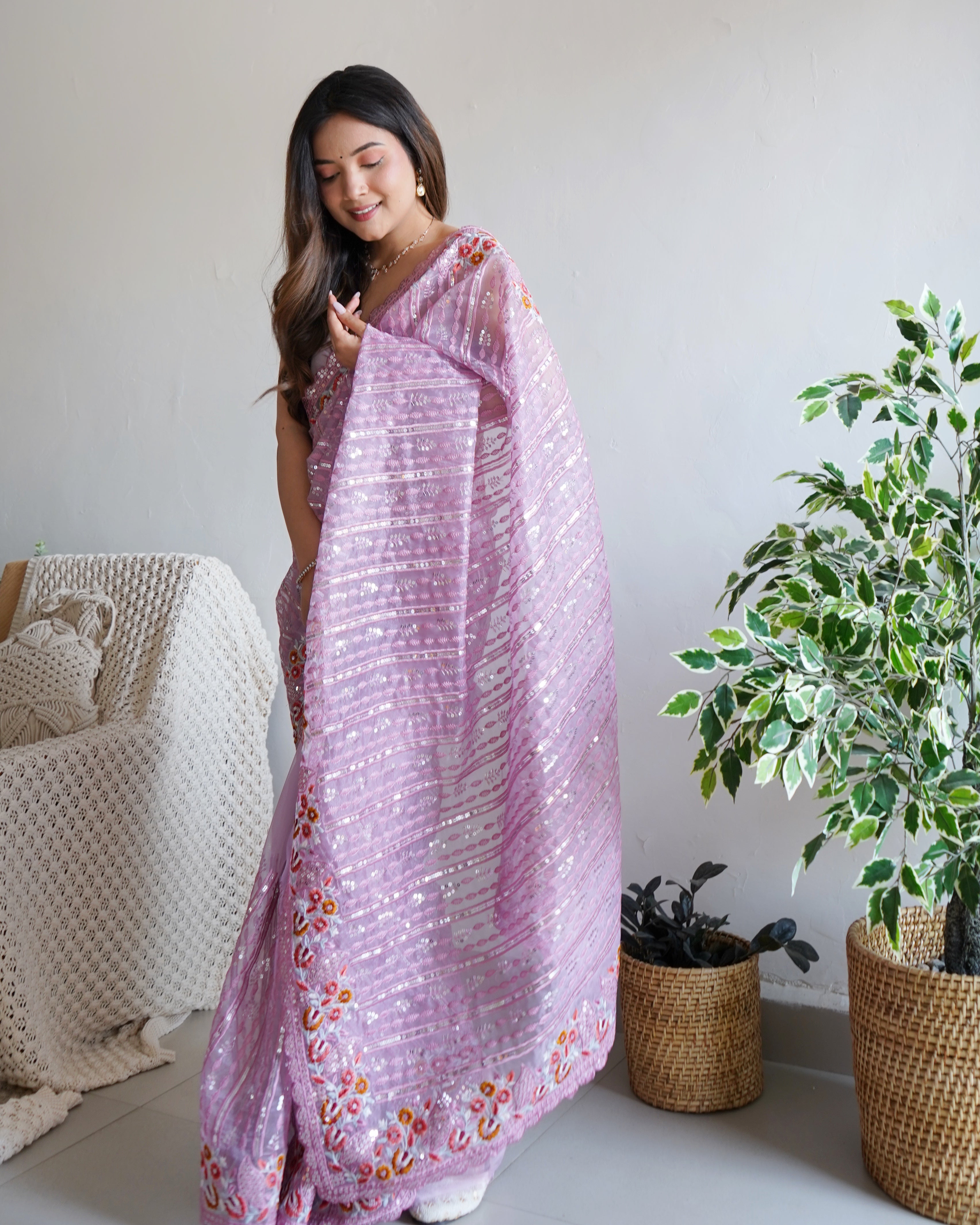 Lavender heavy organza silk saree with 5mm sequin and multi-thread floral embroidery worn by model