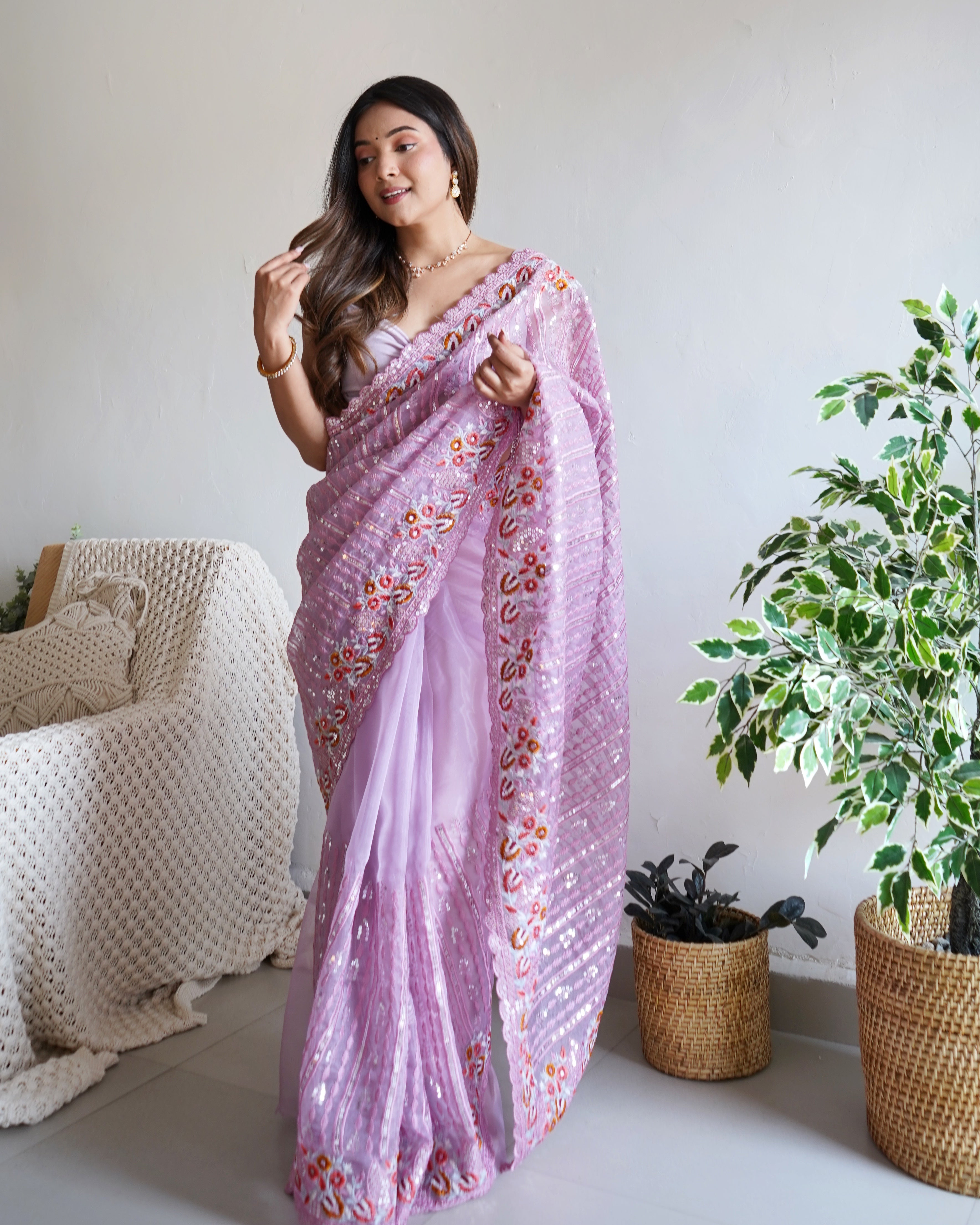 Lavender heavy organza silk saree with 5mm sequin and multi-thread floral embroidery worn by model