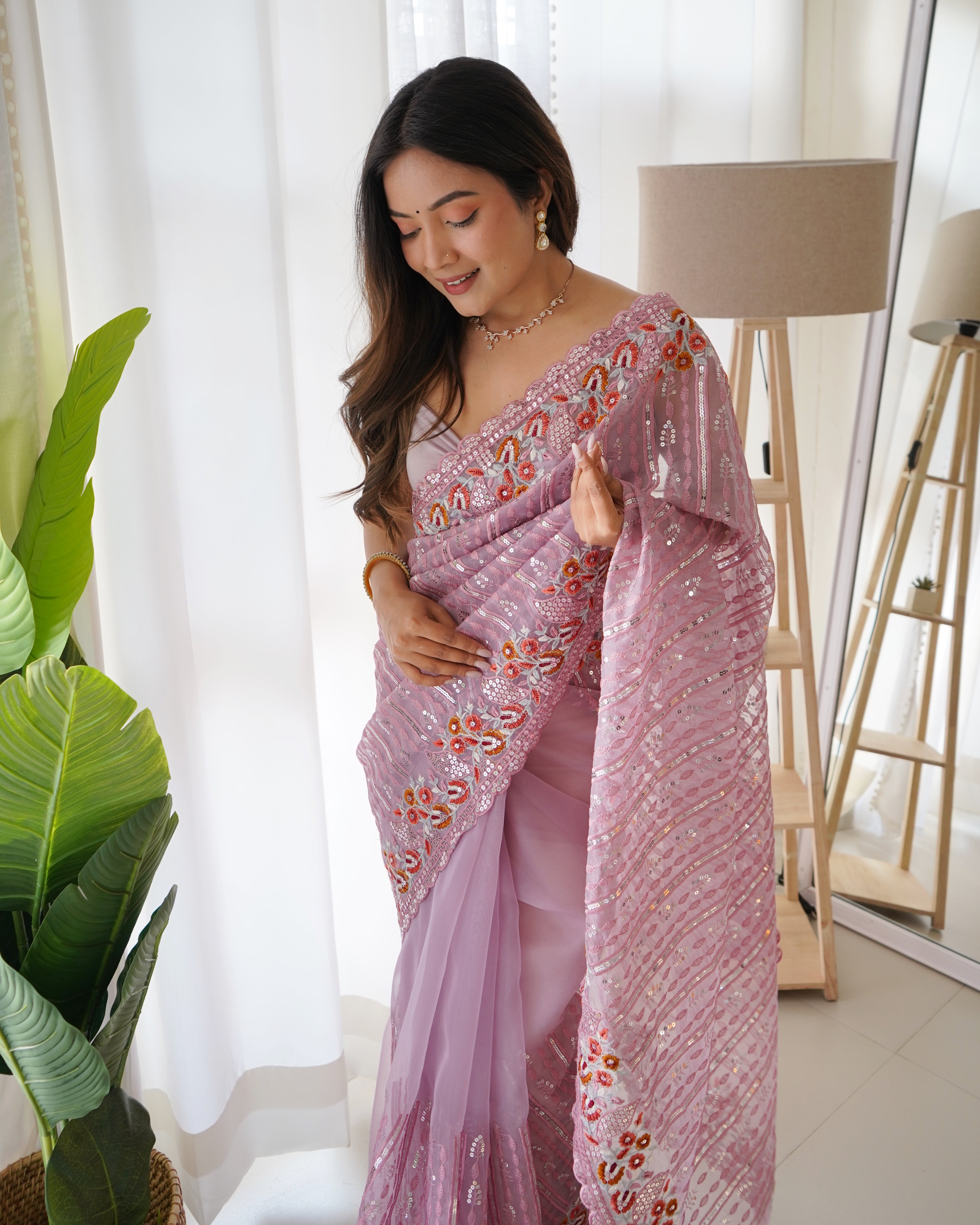 Lavender heavy organza silk saree with 5mm sequin and multi-thread floral embroidery worn by model