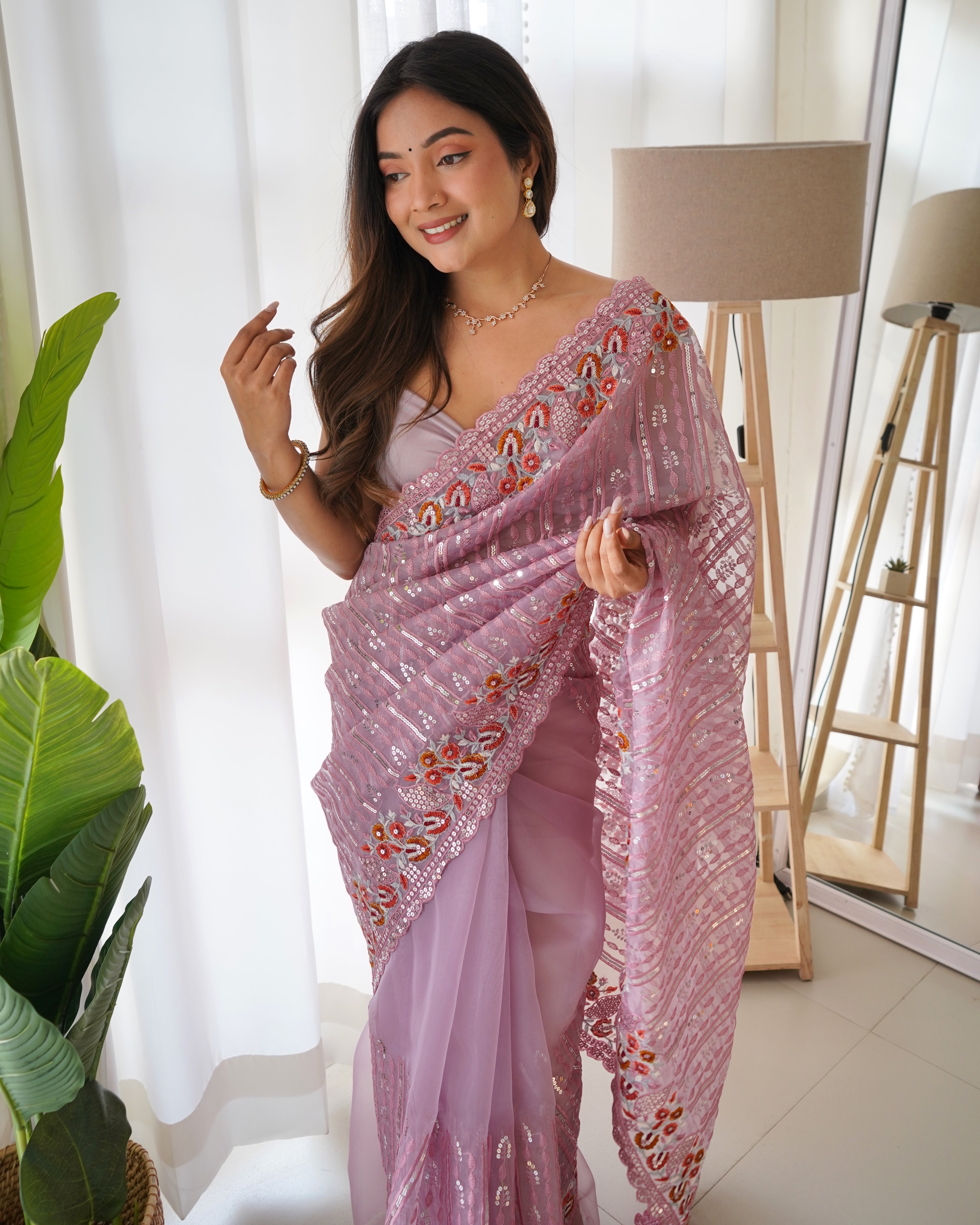 Lavender heavy organza silk saree with 5mm sequin and multi-thread floral embroidery worn by model