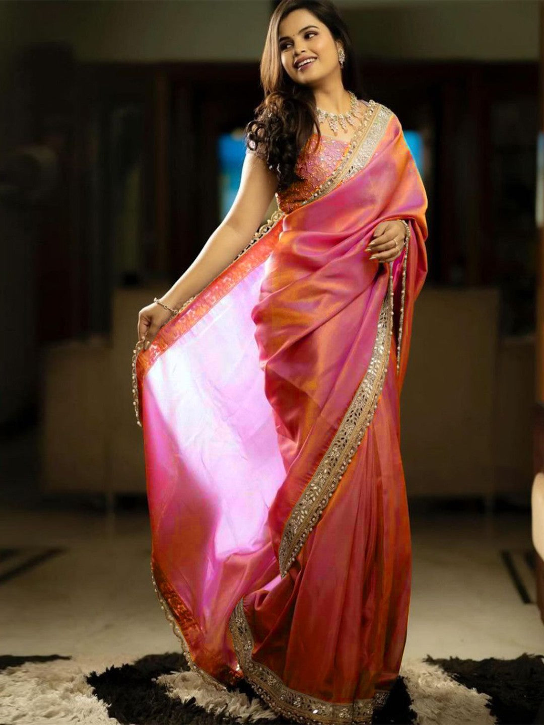 Silver tissue silk saree with real mirror work, zari dori embroidery and moti lace border worn by model